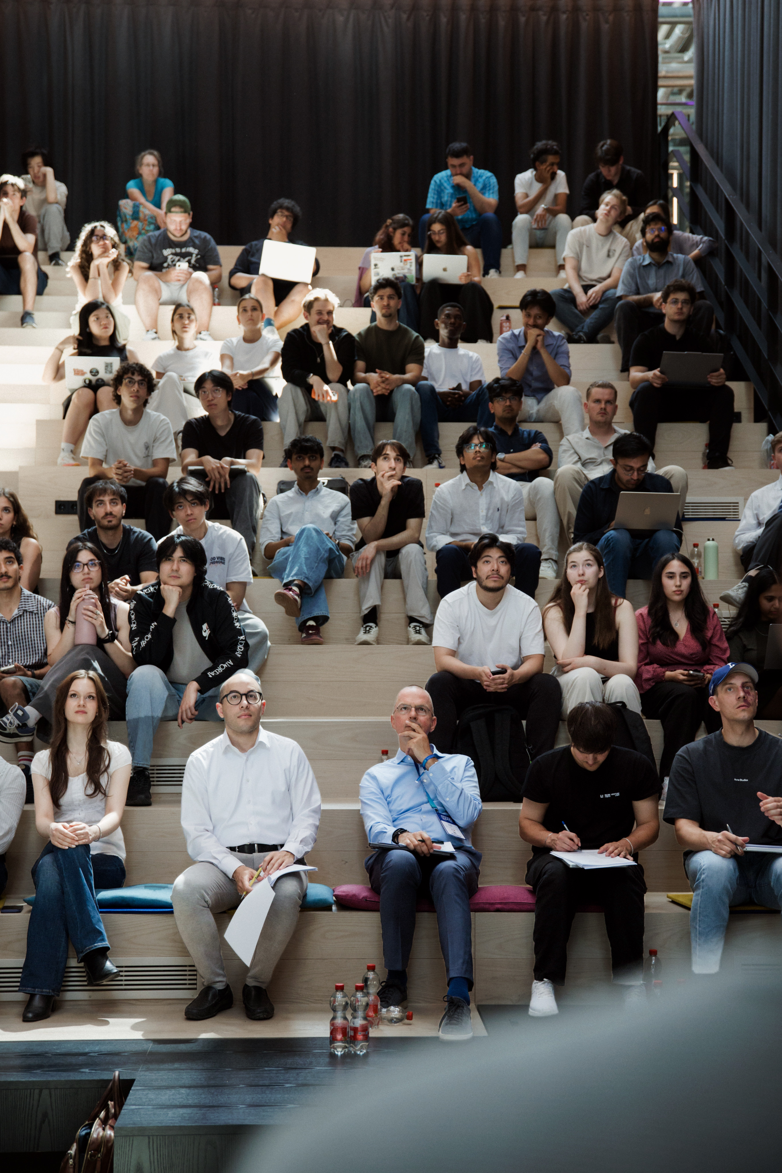 Hackathon participants in the tiered seating during the briefing