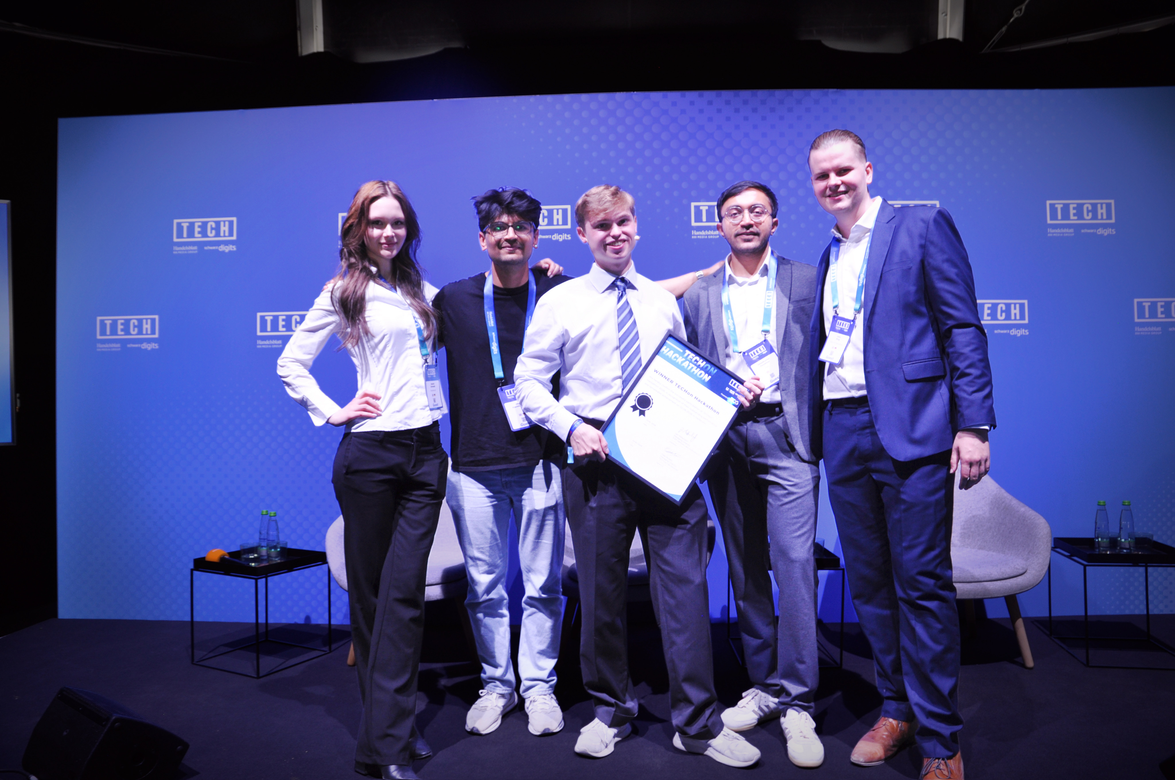 Team Boxworks holding their winning certificate on the TECH stage